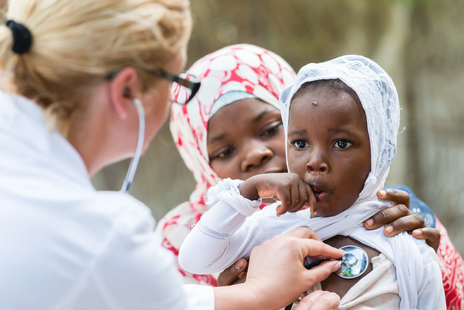 Mother with child receiving healthcare